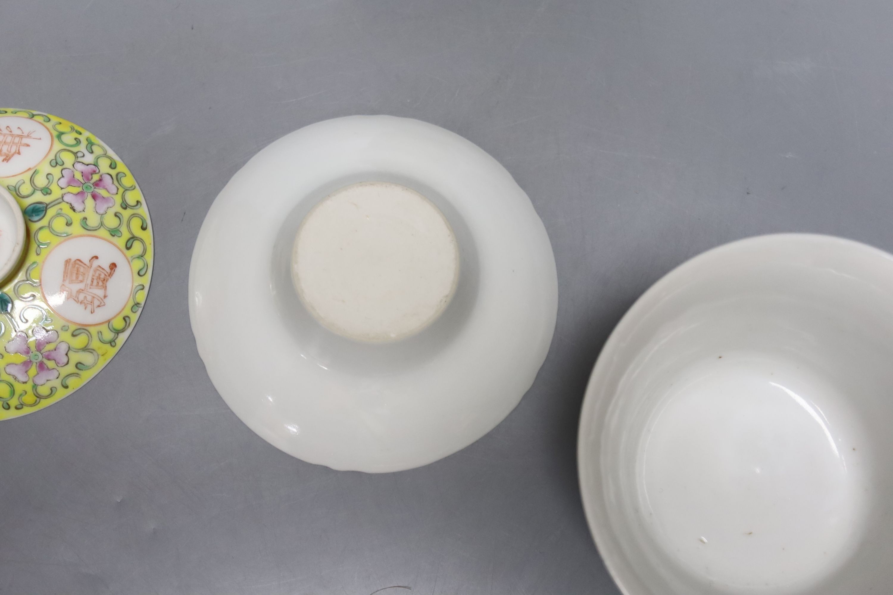A pair of Chinese enamelled porcelain rice bowls, covers and stands and an odd bowl
